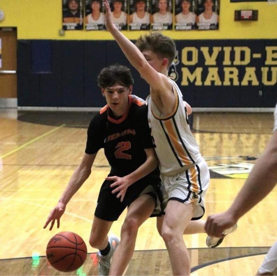 Payton playing high school basketball